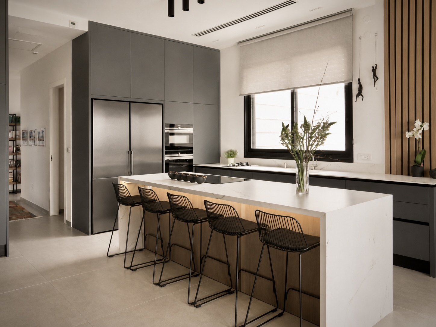 Mota Project — graphite kitchen with marble waterfall island